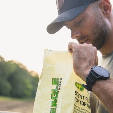 side pic of human and eagle bag